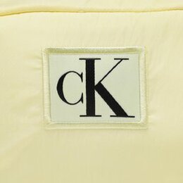 Calvin Klein Jeans: Жёлтая сумка