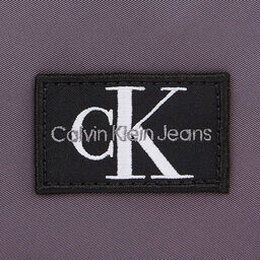 Calvin Klein Jeans: Фиолетовая сумка