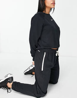 Черно-белые спортивные штаны с кнопками Nike-Мульти 7723619 (lpn4876826) —купить в Москве в LePodium Россия
