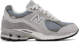 New Balance: Серые кроссовки 