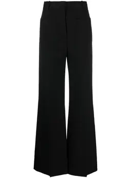 Victoria Beckham: Расклешённые брюки 