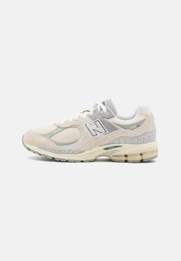 New Balance: Бежевые кроссовки 