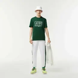 LACOSTE: Зелёная футболка 