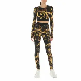 Versace Jeans Couture: Чёрные легинсы 