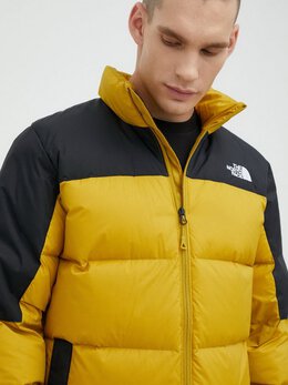 The North Face: Жёлтый пуховик 