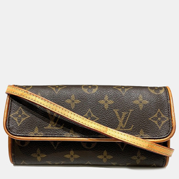 Louis Vuitton: Коричневая сумка  Pochette