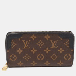 Louis Vuitton: Коричневый кошелёк  Zippy