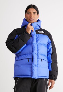 The North Face: Синий пуховик