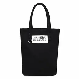 MM6 Maison Margiela: Чёрная сумка 