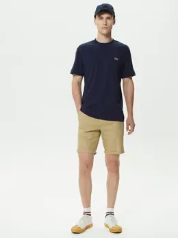 Lacoste: Бежевые шорты 