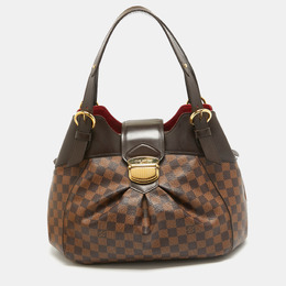 Louis Vuitton: Коричневая сумка 