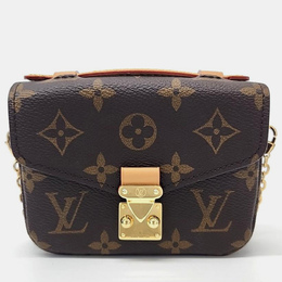 Louis Vuitton: Коричневая сумка 