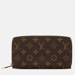 Louis Vuitton: Коричневый кошелёк Zippy