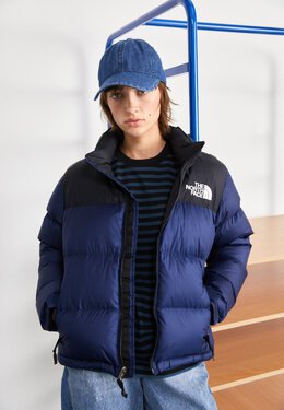 The North Face: Синий пуховик  Nuptse