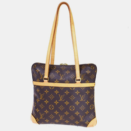Louis Vuitton: Коричневая сумка 