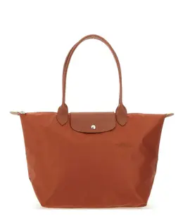 Longchamp: Коричневая сумка  Le Pliage