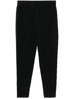 Homme Plissé Issey Miyake: Чёрные брюки 