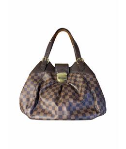 LOUIS VUITTON: Клатч 