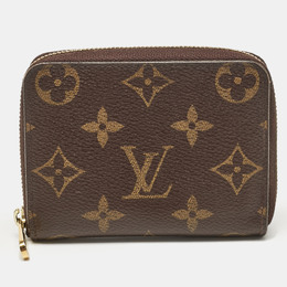 Louis Vuitton: Коричневый кошелёк  Zippy