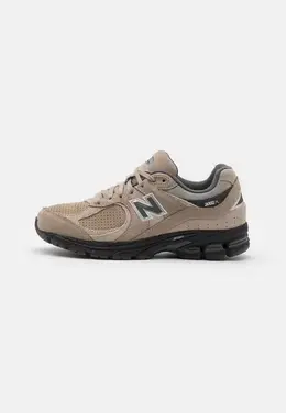 New Balance: Бежевые кроссовки 