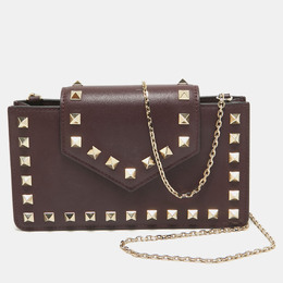 Valentino: Бордовая сумка  Rockstud