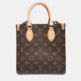 Louis Vuitton: Коричневая сумка 