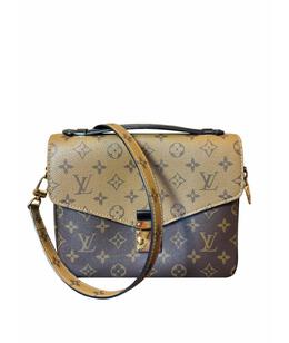 LOUIS VUITTON: Коричневая сумка 