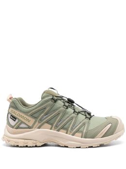 Salomon: Зелёные кроссовки 