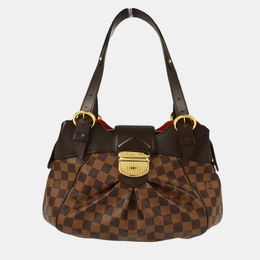 Louis Vuitton: Коричневая сумка 