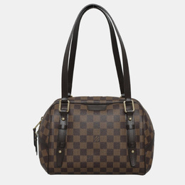 Louis Vuitton: Коричневая сумка 