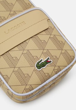 Lacoste: Бежевая сумка 