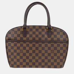 Louis Vuitton: Коричневая сумка 