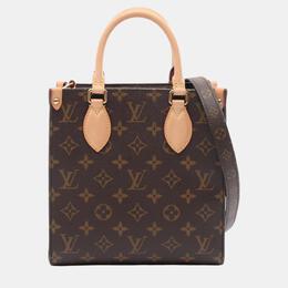 Louis Vuitton: Коричневая сумка 