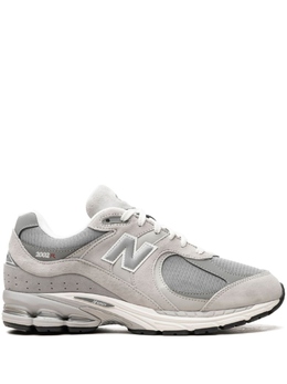 New Balance: Серые кроссовки 