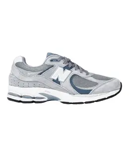New Balance: Серые кроссовки 