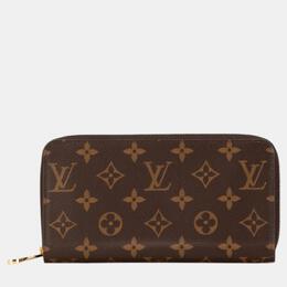 Louis Vuitton: Коричневый кошелёк  Zippy