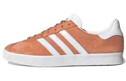 adidas: Оранжевые кеды  Gazelle