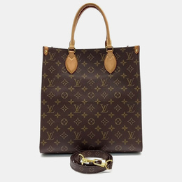 Louis Vuitton: Коричневая сумка 