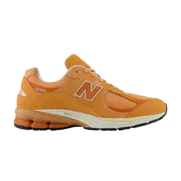 New Balance: Оранжевые кроссовки  2002R