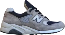 New Balance: Серые кроссовки 