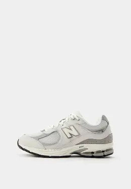 New Balance: Серые кроссовки 