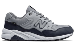 New Balance: Серые кроссовки 