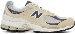New Balance: Бежевые кроссовки  2002R