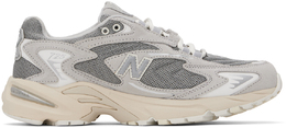 New Balance: Серые кроссовки 