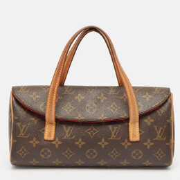 Louis Vuitton: Коричневая сумка 