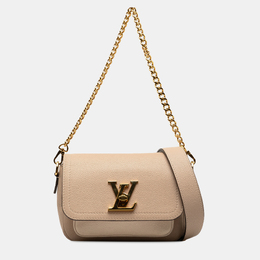 Louis Vuitton: Коричневая сумка 