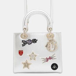 Dior: Серебристая сумка 