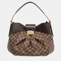 Louis Vuitton: Коричневая сумка 