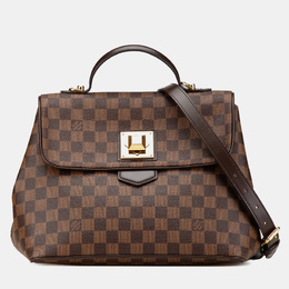 Louis Vuitton: Коричневая сумка 