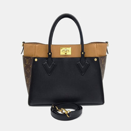 Louis Vuitton: Коричневая сумка 